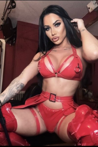 Mistress Nattasha Black dressed in red latex underwear 